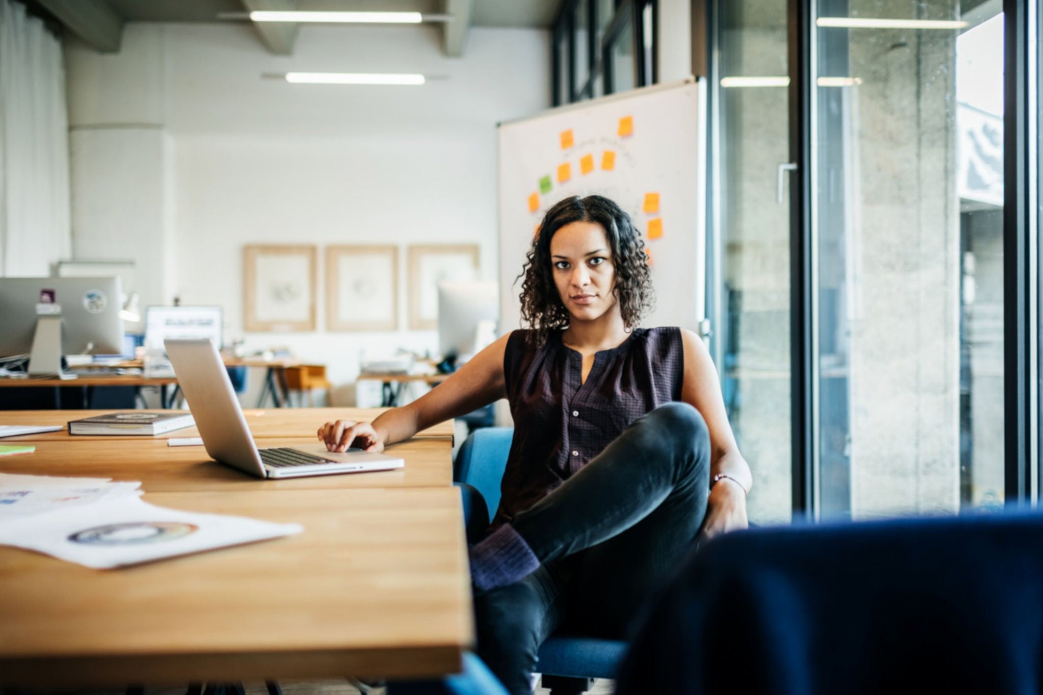 Woman with computer at desk version