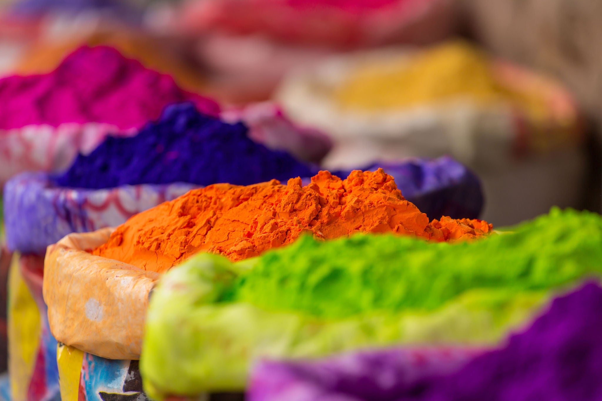 Colorful piles of powdered dyes used for Holi festival in India