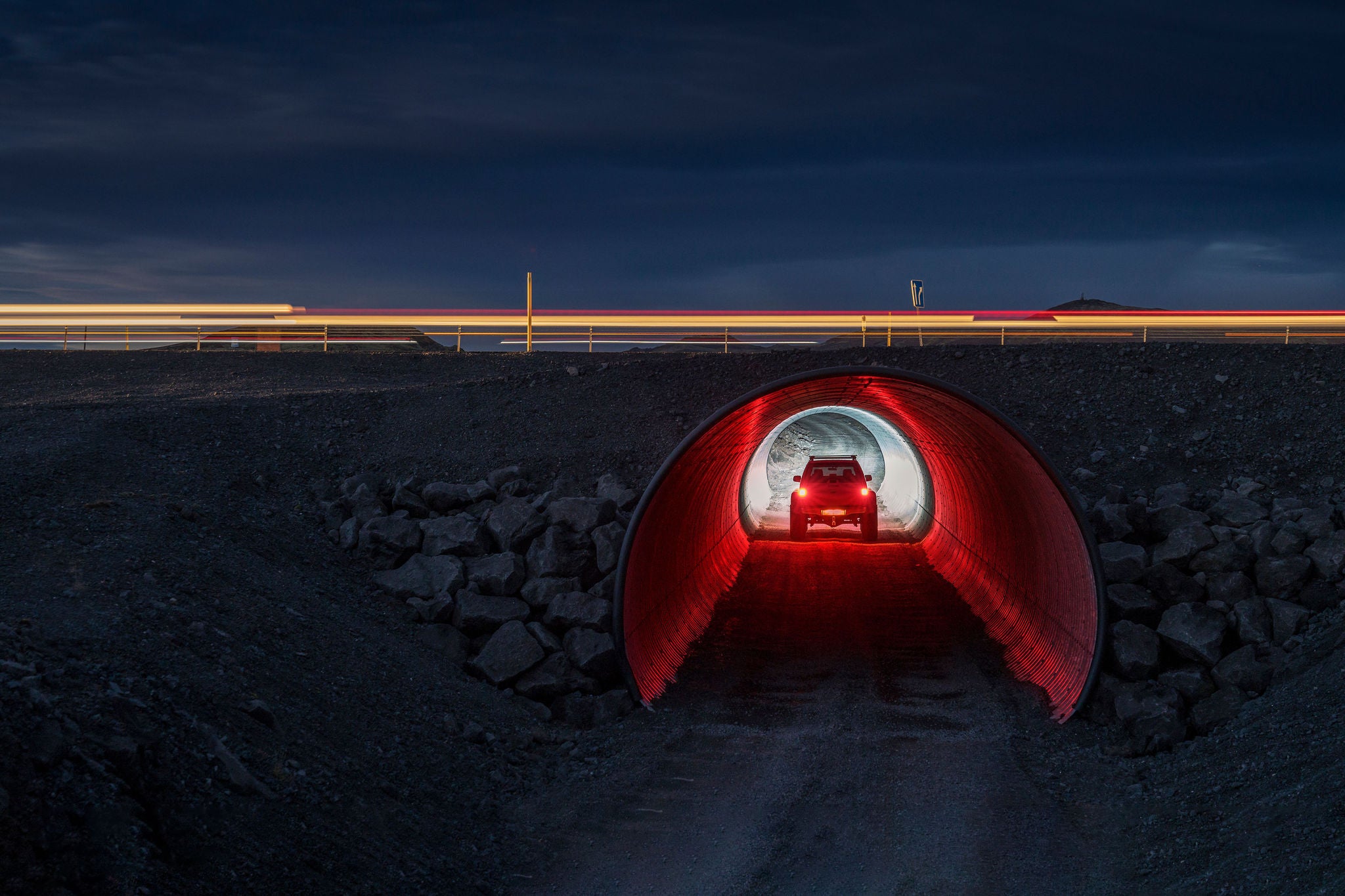 SUV driving through small tunnel